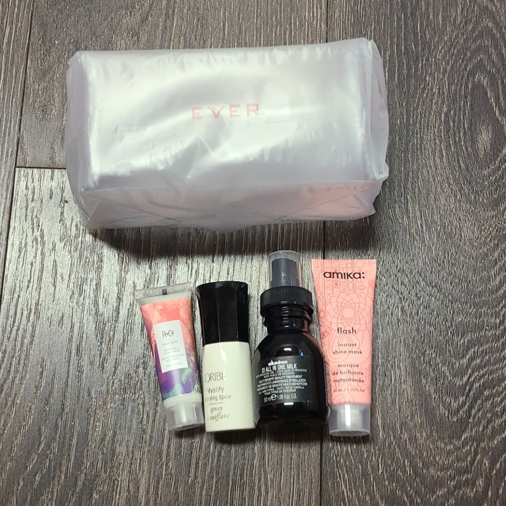 Four mini hair products and bag